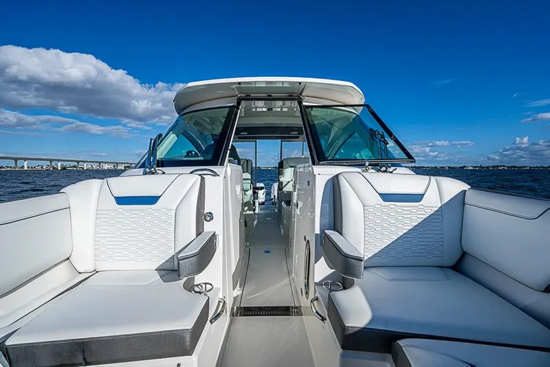 Slide: The Image of 2022 Tiara Yachts 34 LX interior view with open hatch and seating area. - 45