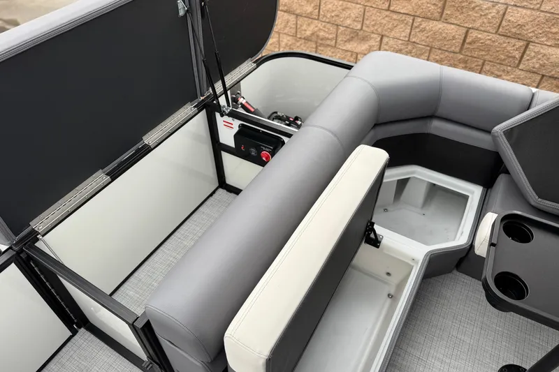 Slide: The Image of Interior of 2026 Berkshire 21CL STS boat with storage compartments and seating. - 21