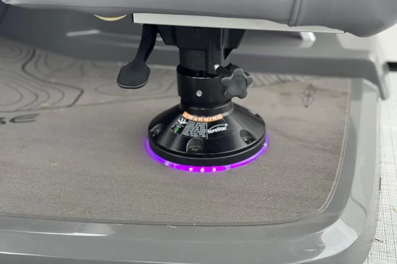 Slide: The Image of Adjustable seat base with purple LED lighting on 2026 Berkshire 21CL STS boat. - 28
