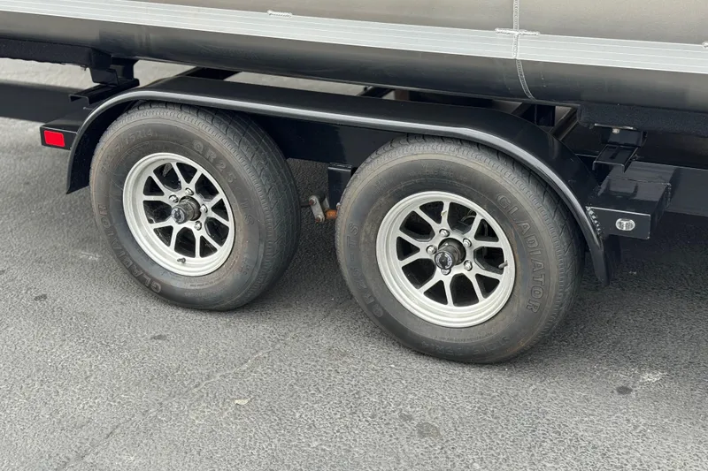 Slide: The Image of Trailer wheels of a 2026 Berkshire 21CL STS on asphalt surface. - 32