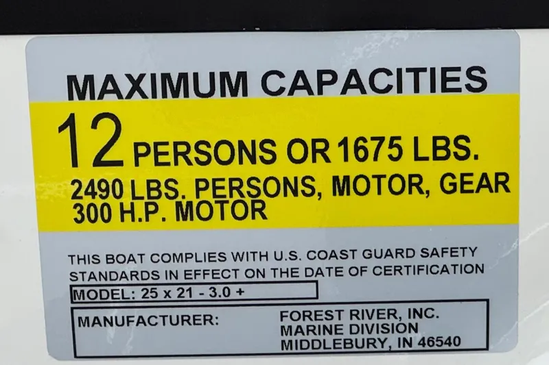 Slide: The Image of 2026 Berkshire 21CL STS boat capacity label: 12 persons, 1675 lbs, 300 HP motor. - 34