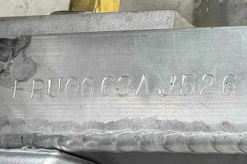 Slide: The Image of Close-up of a metal surface with engraved serial number FRU66C3AJ526. Berkshire 21CL STS 2026. - 35