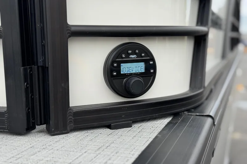 Slide: The Image of Close-up of a 2026 Berkshire 21CL STS audio control panel on a boat. - 9