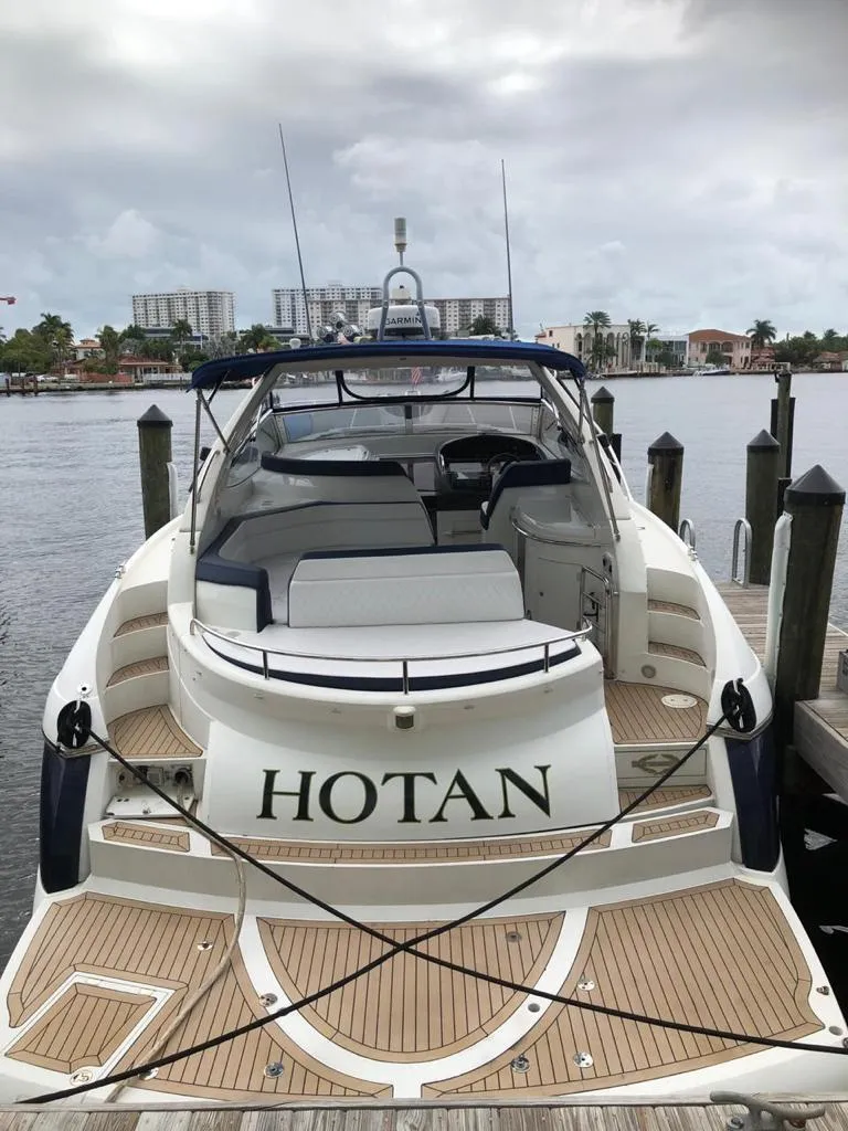 Slide: The Image of 2003 Sunseeker Portofino 46 yacht docked at marina, rear view. - 11