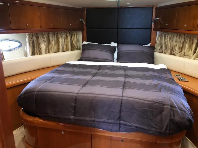 Slide: The Image of Luxurious cabin interior of 2003 Sunseeker Portofino 46 yacht with cozy bedding. - 18