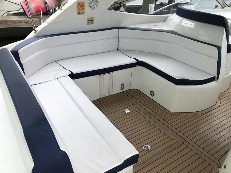 Slide: The Image of Luxurious seating area on 2003 Sunseeker Portofino 46 yacht with elegant white cushions. - 7