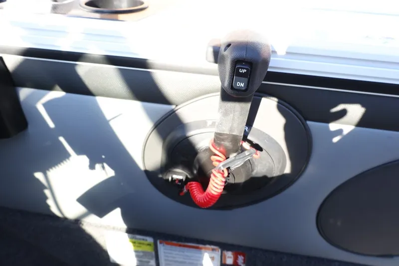 Slide: The Image of Control panel of 2026 Lund 1875 Crossover XS boat with up-down switch. - 28