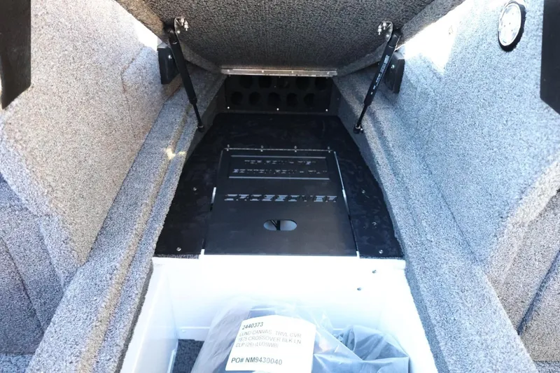 Slide: The Image of Interior view of 2026 Lund 1875 Crossover XS boat storage compartment. - 35