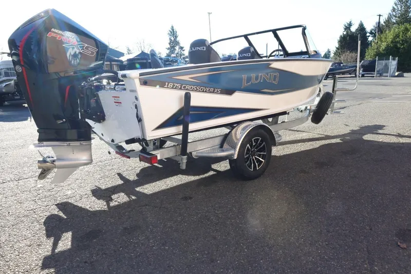 Slide: The Image of 2026 Lund 1875 Crossover XS boat on trailer with Mercury Pro XS engine. - 6