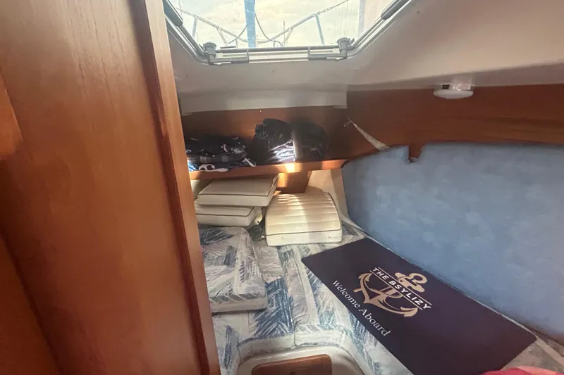 Slide: The Image of 1995 Catalina 320 yacht kitchen with stove, microwave, and sink. - 8