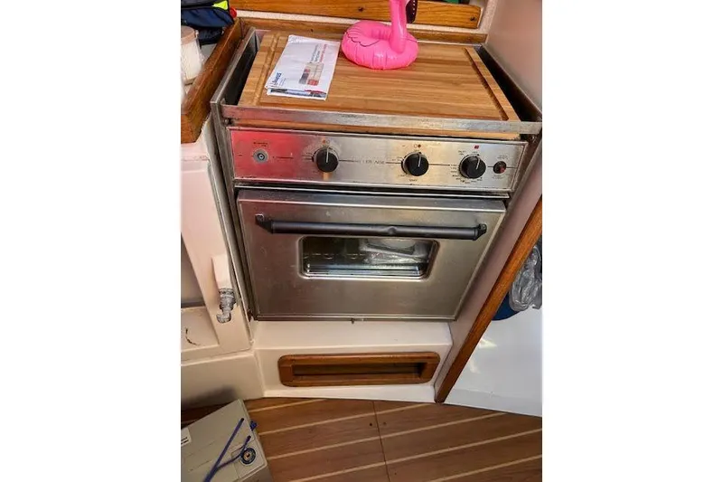 Slide: The Image of Stainless steel oven in 2003 Catalina 310 yacht kitchen with wooden accents. - 16