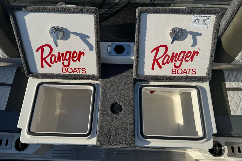 Slide: The Image of 2026 Ranger 620xFS Pro boat storage compartments with Ranger Boats branding. - 12