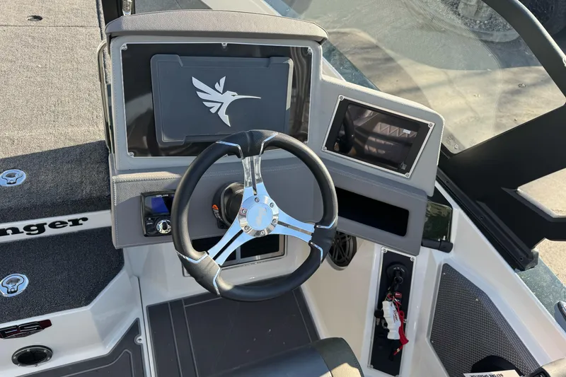 Slide: The Image of 2026 Ranger 620xFS Pro boat dashboard with steering wheel and control panel. - 15