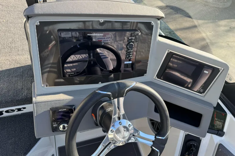 Slide: The Image of 2026 Ranger 620xFS Pro boat dashboard with steering wheel and electronic displays. - 16