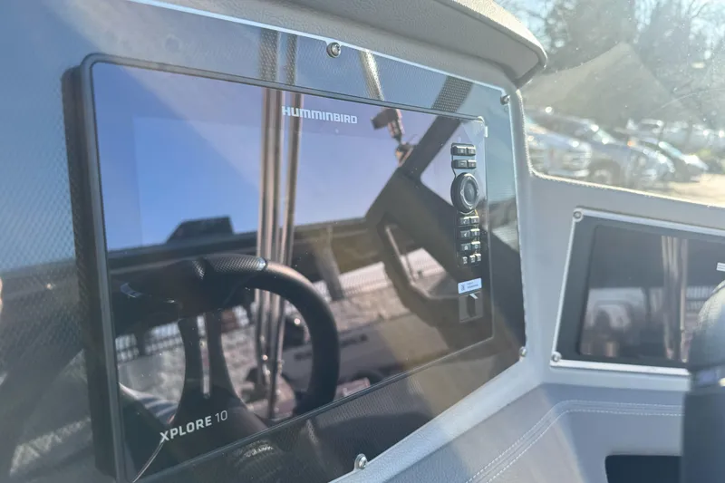 Slide: The Image of 2026 Ranger 620xFS Pro boat dashboard with Humminbird Xplore 10 display. - 17