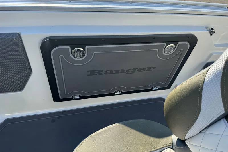 Slide: The Image of 2026 Ranger 620xFS Pro boat interior with branded storage compartment and seating. - 19
