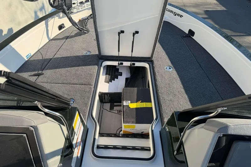 Slide: The Image of Open storage compartment on 2026 Ranger 620xFS Pro boat deck. - 24
