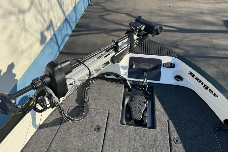 Slide: The Image of 2026 Ranger 620xFS Pro boat deck with trolling motor and foot pedal. - 29