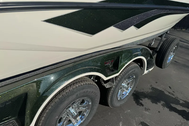 Slide: The Image of 2026 Ranger 620xFS Pro boat trailer with dual axles and chrome wheels. - 3