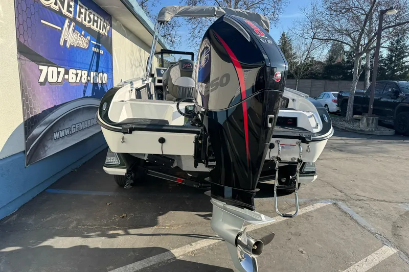 Slide: The Image of 2026 Ranger 620xFS Pro boat with powerful outboard motor in parking lot. - 5