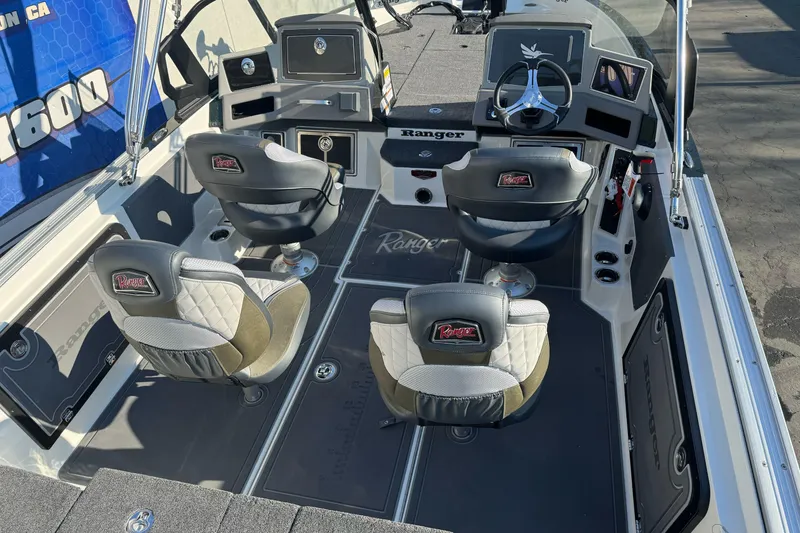 Slide: The Image of 2026 Ranger 620xFS Pro boat interior with four seats and modern dashboard. - 6