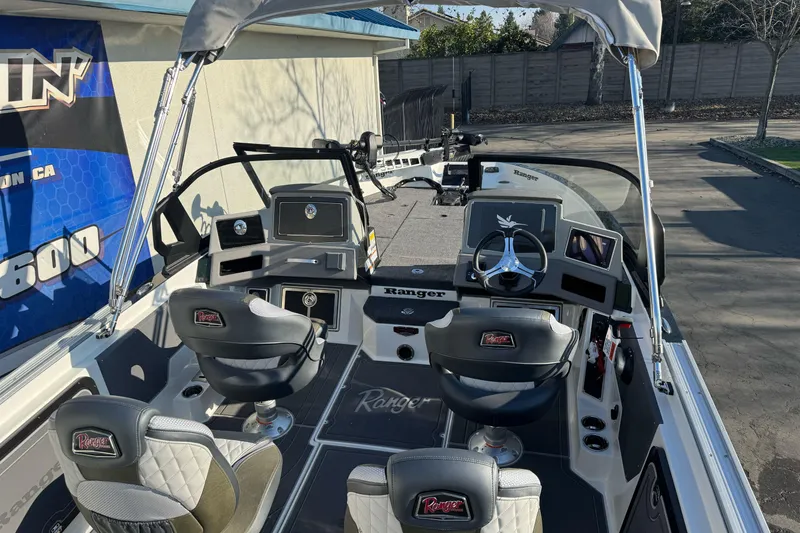 Slide: The Image of 2026 Ranger 620xFS Pro boat interior with dual seats and modern dashboard. - 7