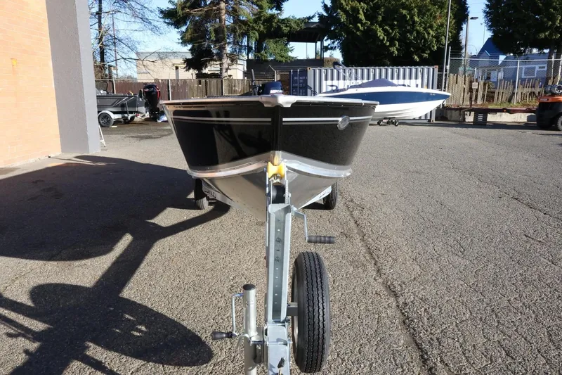 Slide: The Image of 2026 Lund 1600 Fury Tiller boat on trailer in outdoor setting. - 3