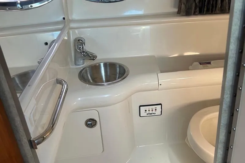 Slide: The Image of Bathroom interior of 2006 Formula 330 Sun Sport boat with sink and toilet. - 13