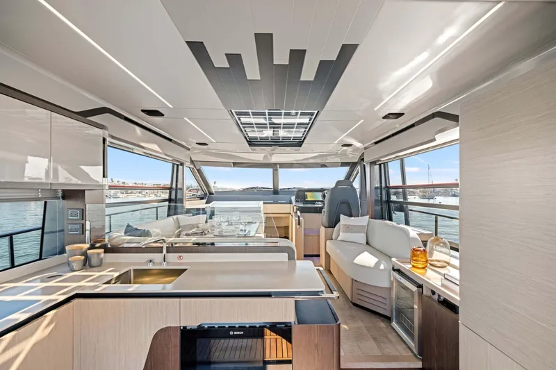 Slide: The Image of Luxurious interior of 2026 Absolute 48 Coupe yacht with modern design and panoramic windows. - 19