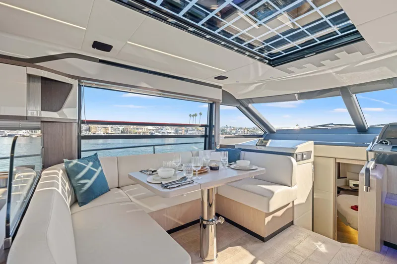 Slide: The Image of Luxurious interior of 2026 Absolute 48 Coupe yacht with elegant dining area. - 22