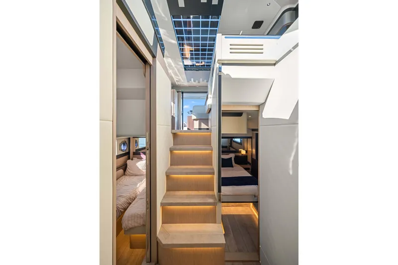 Slide: The Image of Interior of 2026 Absolute 48 Coupe yacht, featuring modern design and luxurious cabins. - 25