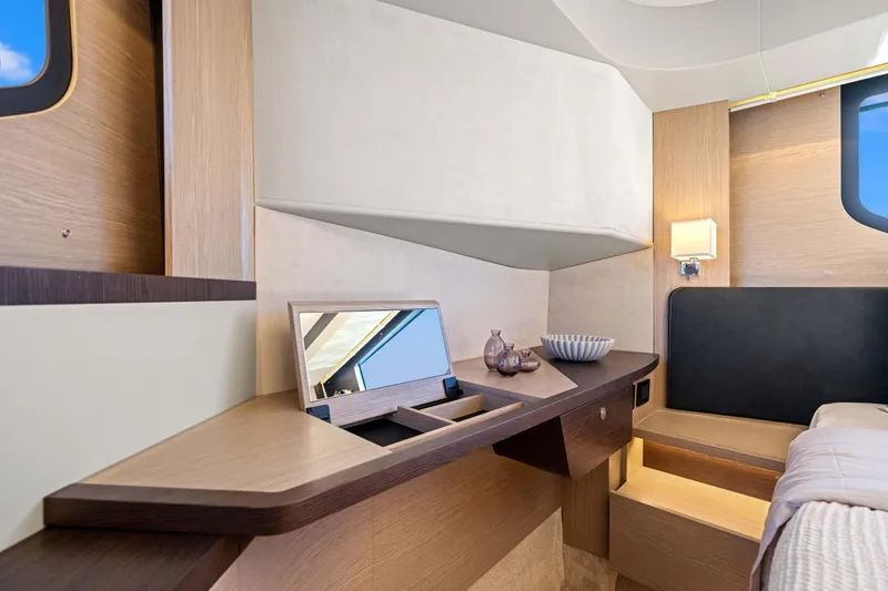 Slide: The Image of Luxurious interior of 2026 Absolute 48 Coupe yacht with modern wood finishes. - 28