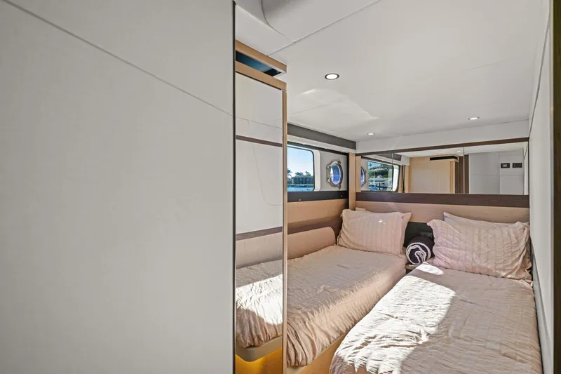 Slide: The Image of Interior of 2026 Absolute 48 Coupe yacht with twin beds and modern design. - 33