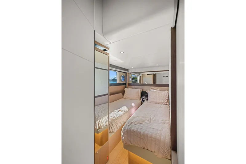 Slide: The Image of Luxurious bedroom interior of 2026 Absolute 48 Coupe yacht with twin beds and modern design. - 35