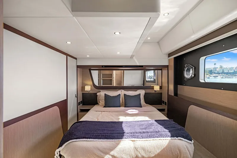 Slide: The Image of Luxurious bedroom interior of 2026 Absolute 48 Coupe yacht with modern design and scenic window view. - 36