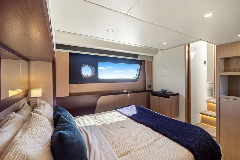 Slide: The Image of Luxurious bedroom interior of 2026 Absolute 48 Coupe yacht with modern design and ocean view. - 38