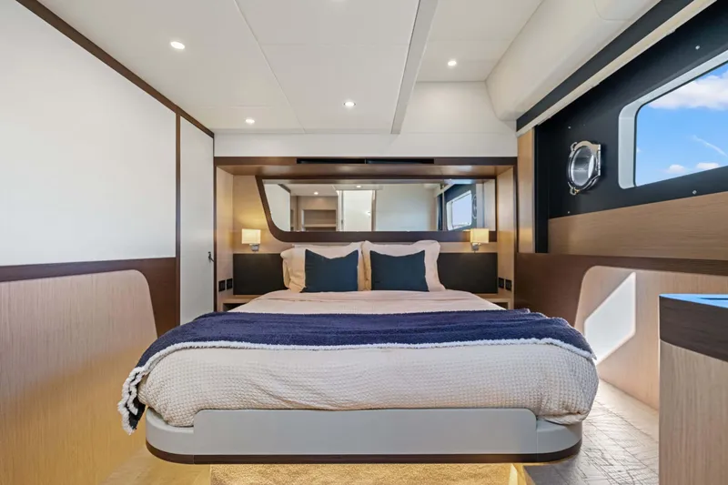 Slide: The Image of Luxurious bedroom interior of 2026 Absolute 48 Coupe yacht, featuring modern design and cozy bedding. - 39