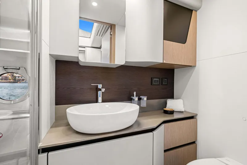 Slide: The Image of Luxurious bathroom interior of 2026 Absolute 48 Coupe yacht with modern fixtures and elegant design. - 42