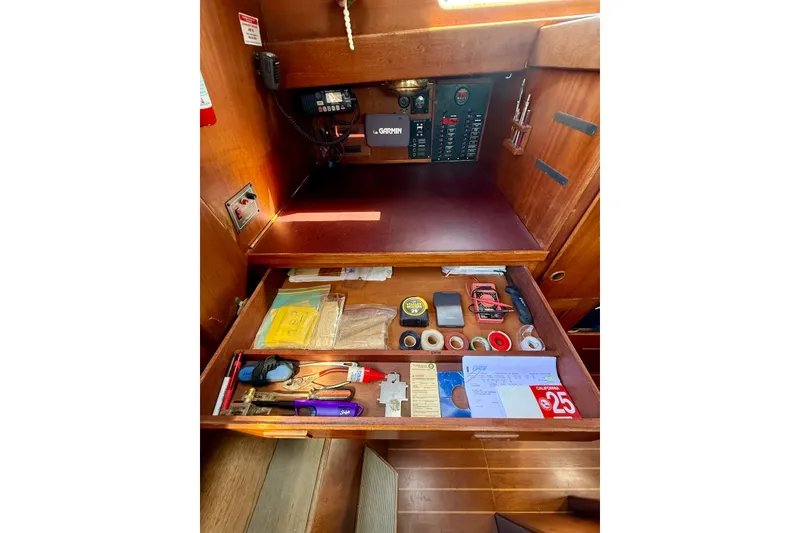 Slide: The Image of Interior of 1978 Vindo 50 sailboat with organized navigation tools and equipment. - 12