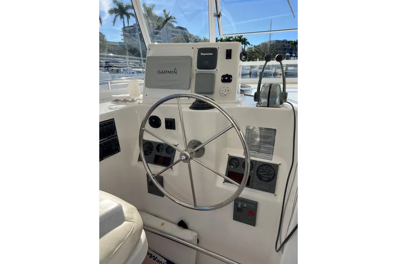 Slide: The Image of Helm of 2003 Endeavour 36 TrawlerCat with Garmin and Raymarine navigation systems. - 12