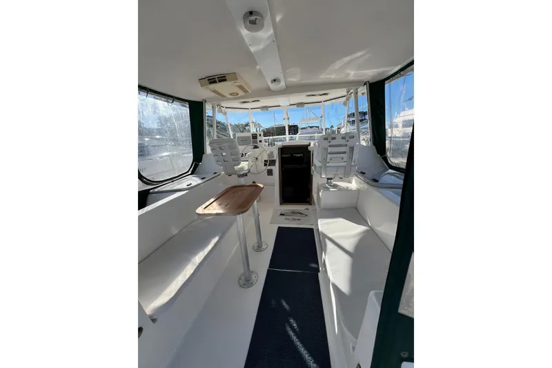 Slide: The Image of Interior of 2003 Endeavour 36 TrawlerCat, featuring spacious seating and helm area. - 13