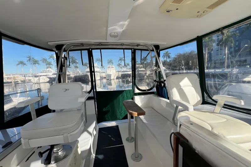 Slide: The Image of Interior view of 2003 Endeavour 36 TrawlerCat with marina backdrop and palm trees. - 14