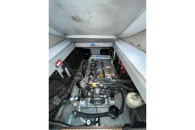Slide: The Image of Engine compartment of a 2003 Endeavour 36 TrawlerCat, showcasing mechanical components. - 15