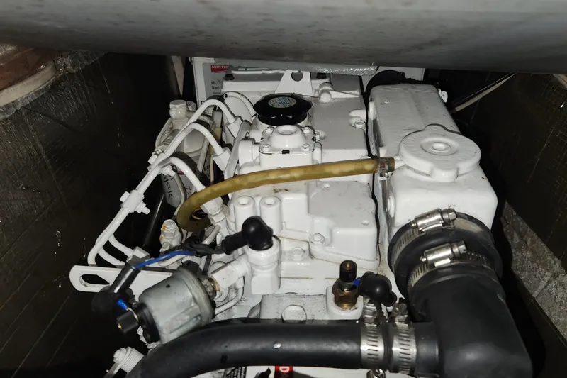 Slide: The Image of Engine compartment of a 2003 Endeavour 36 TrawlerCat, showcasing mechanical components. - 18