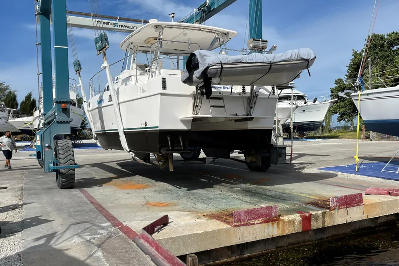 Slide: The Image of 2003 Endeavour 36 TrawlerCat on a marine travel lift at a boatyard. - 27