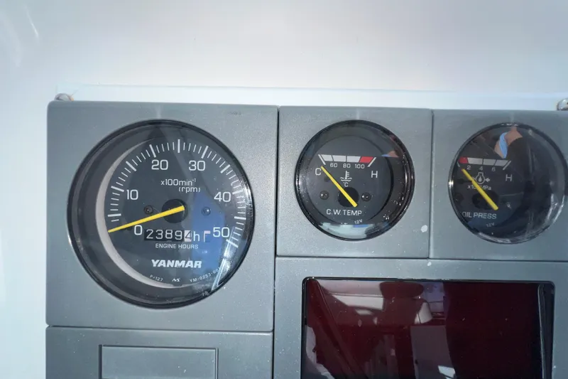 Slide: The Image of Dashboard gauges of a 2003 Endeavour 36 TrawlerCat, showing engine hours and temperature. - 31