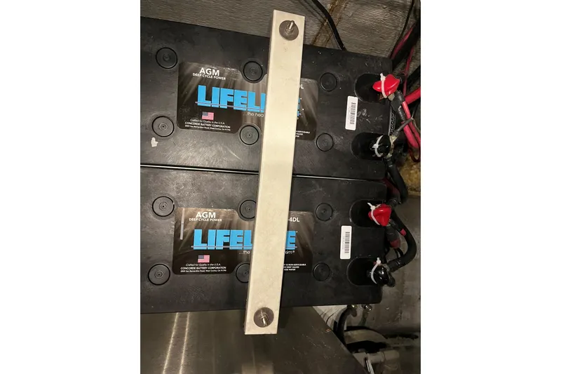 Slide: The Image of AGM deep cycle batteries in a 2003 Endeavour 36 TrawlerCat engine room. - 33