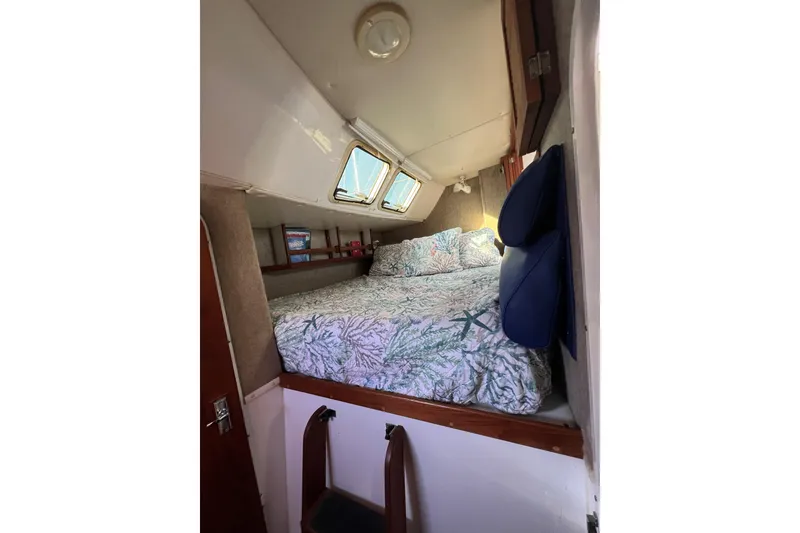 Slide: The Image of Cozy cabin interior of 2003 Endeavour 36 TrawlerCat with bed and porthole windows. - 5