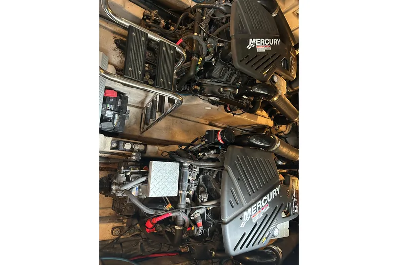 Slide: The Image of Engine compartment of a 2004 Sea Ray 420 Sundancer with twin Mercury engines. - 15