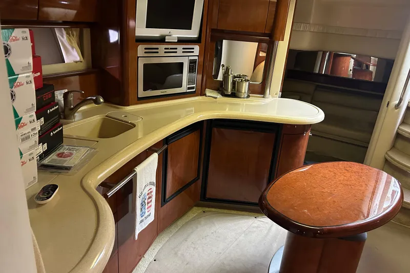 Slide: The Image of Luxurious 2004 Sea Ray 420 Sundancer yacht interior with modern kitchen amenities. - 18